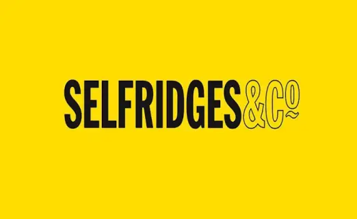 A bright yellow background features the text 'SELFRIDGES & CO' in bold black letters, emphasizing the brand name.