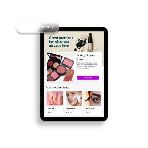 A tablet screen displays a beauty product advertisement featuring a Spring Blusher for €39, with suggestions for Lipstick, Sunscreen, and Mascara.